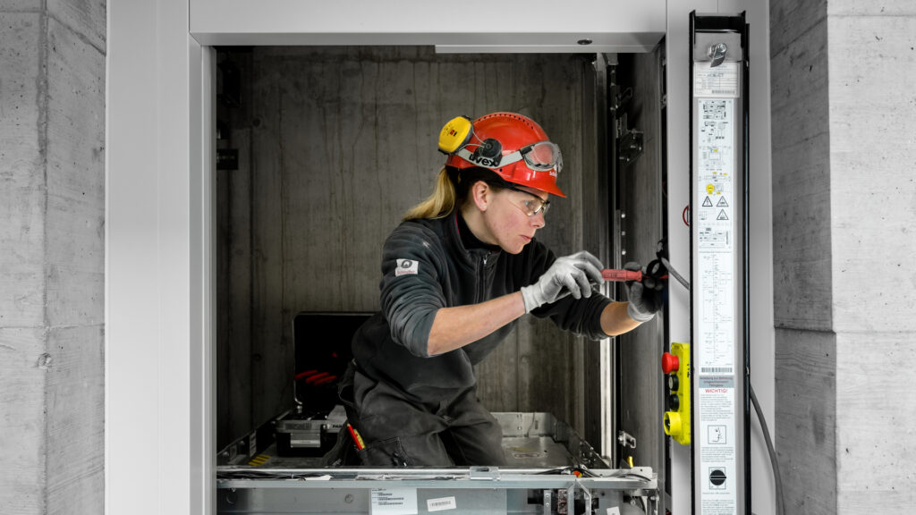 a schindler service technician installs an elevator